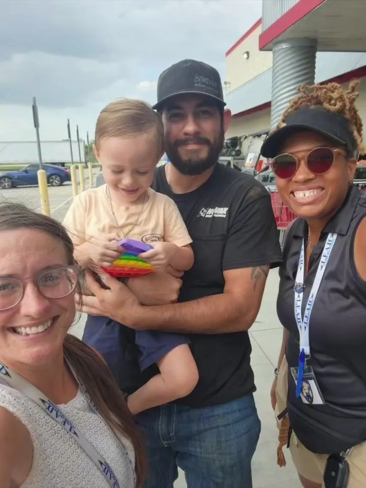 A GA Jersey Village team member connecting with a family during a community outreach event