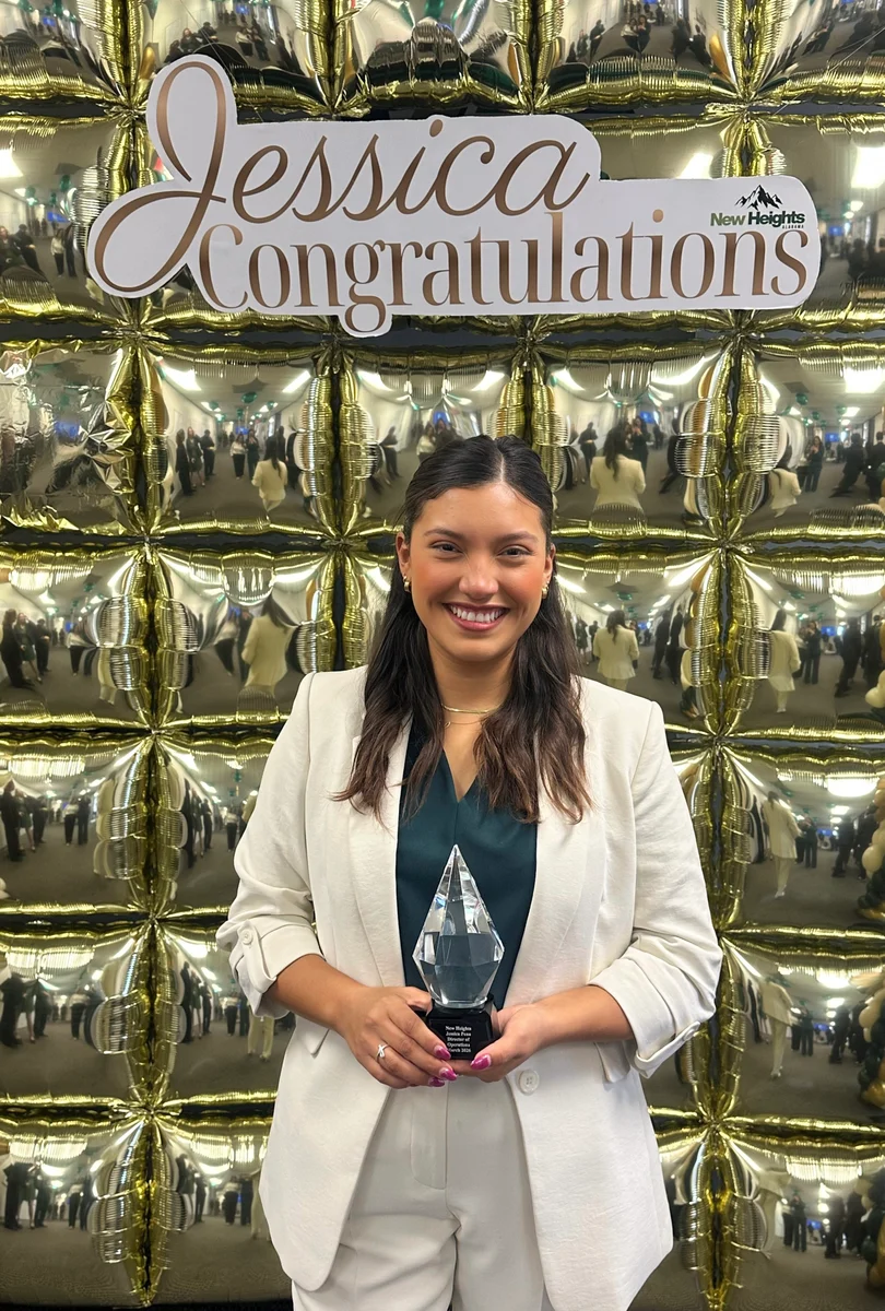 A GA Jersey Village team member celebrating a recognition